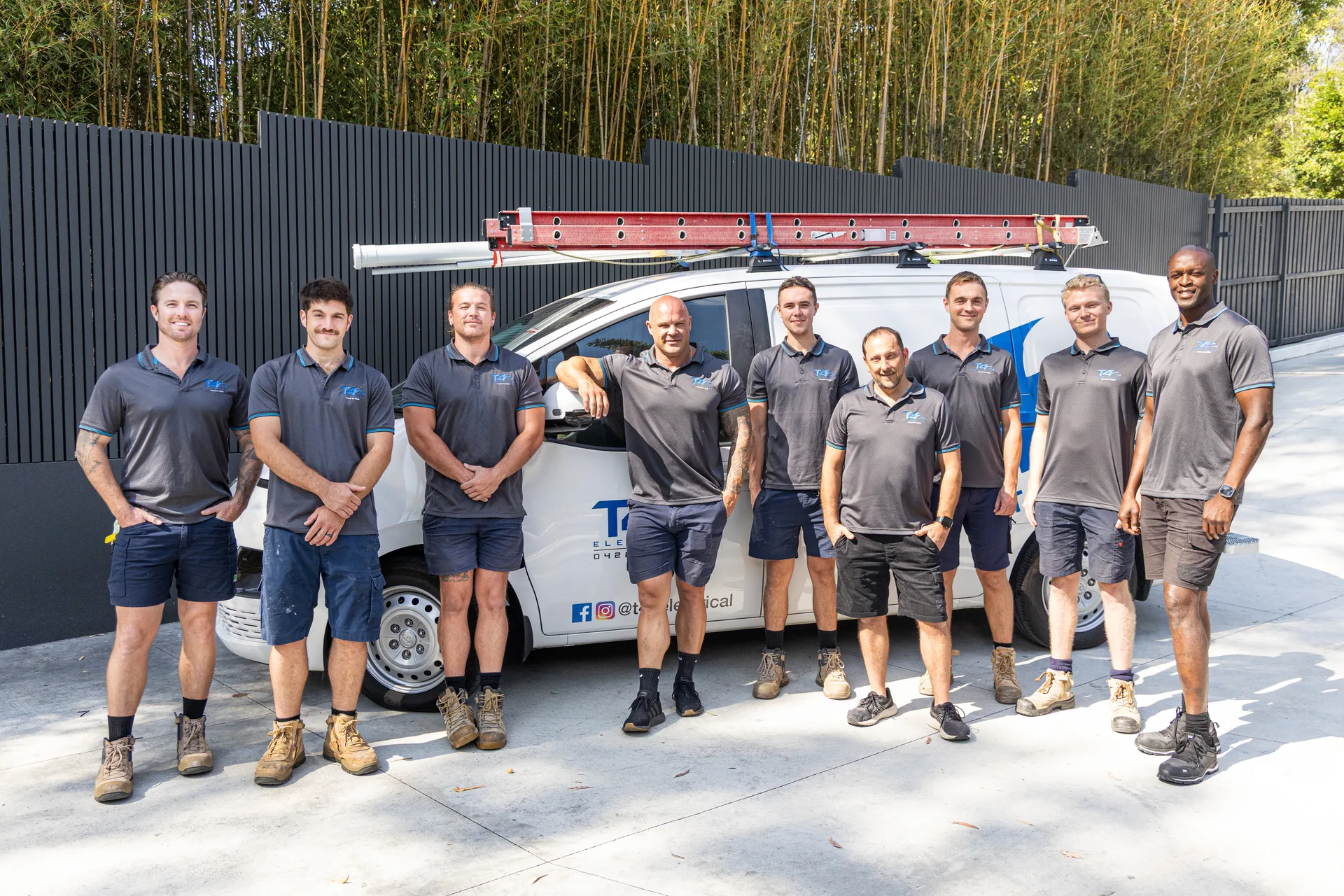 The Family Electrician Bundall team with a service van